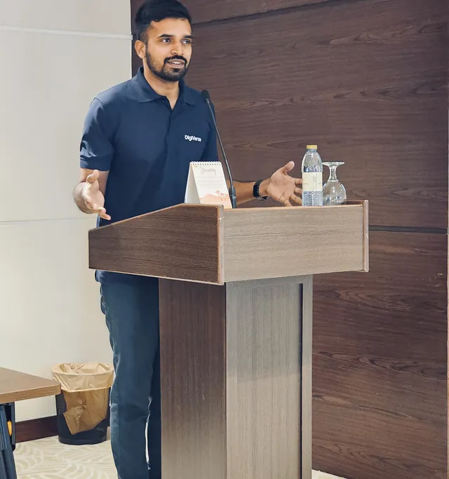 Abhijith speaking at a podium